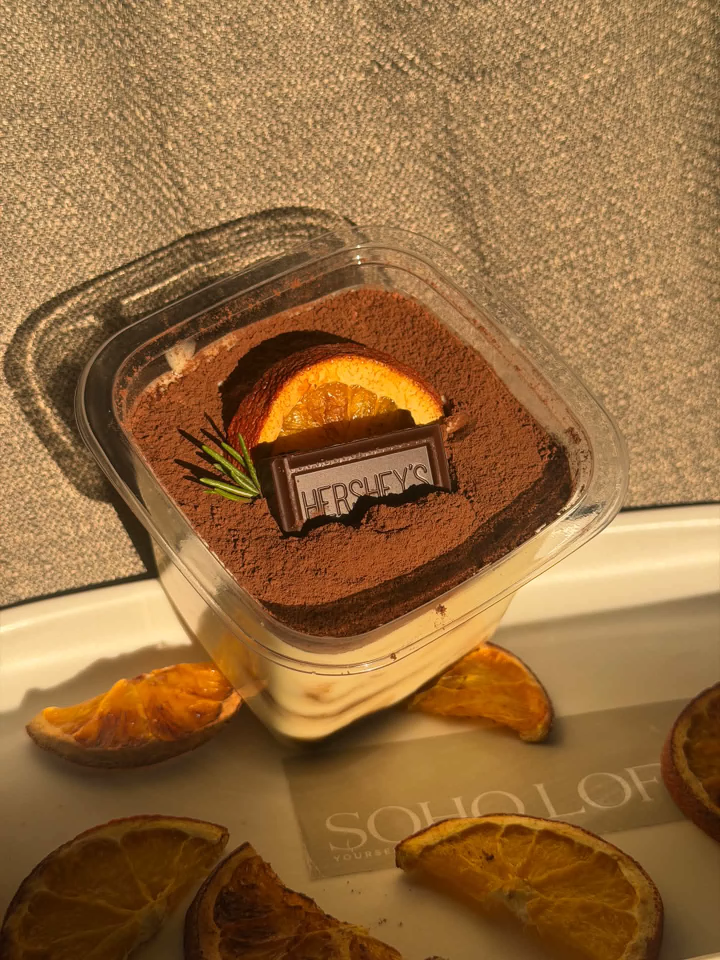 Cocoa tiramisu with dried orange and a chocolate garnish